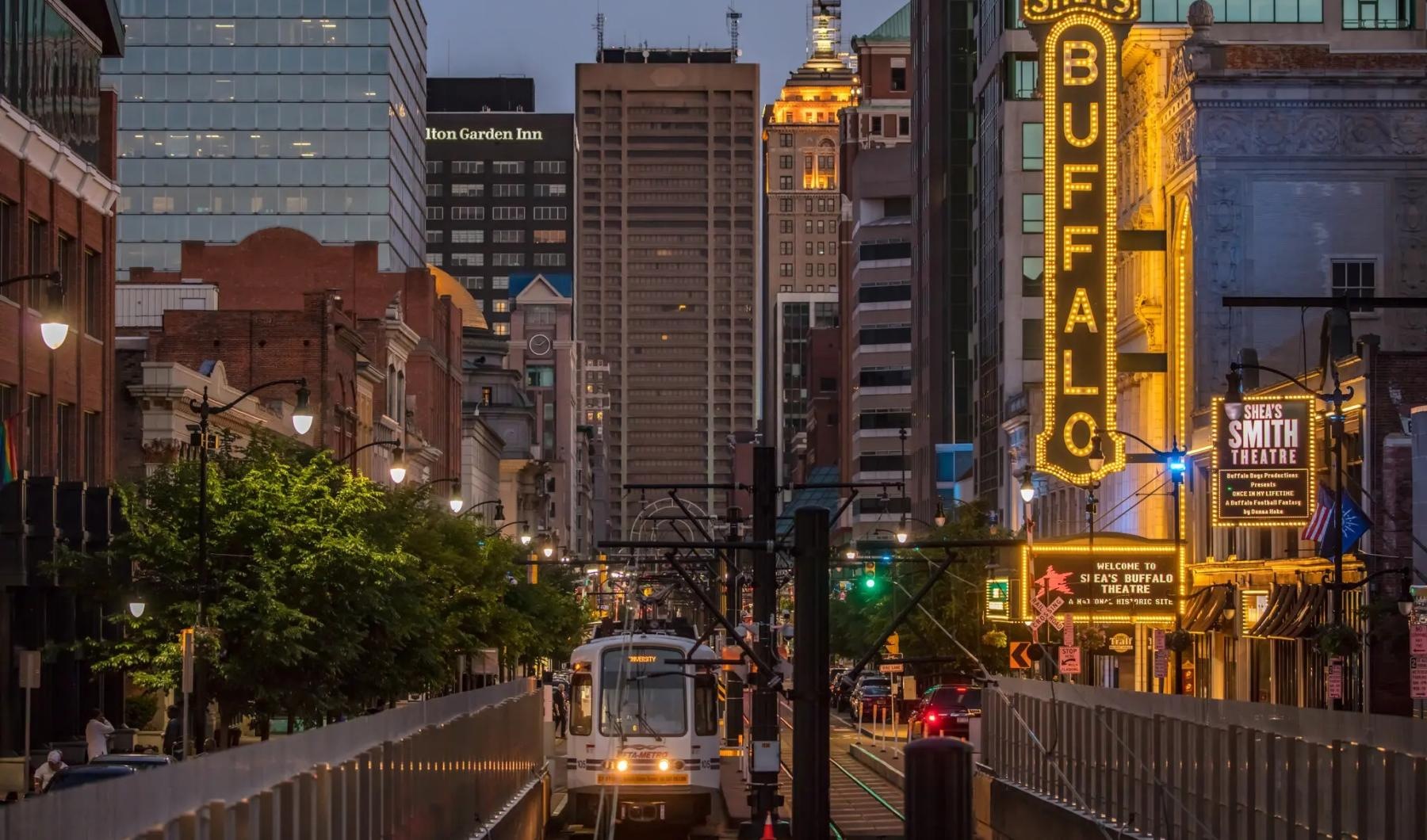 a city street with tall buildings